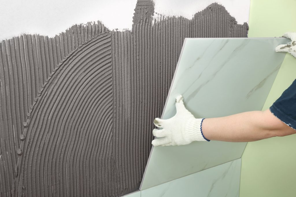Wall tile adhesive for easy vertical tile installation